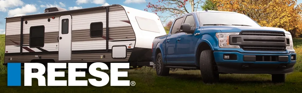 Pickup truck using a Reese trailer hitch to pull a RV camper trailer